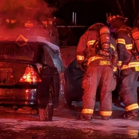 Firefighters Contain Vehicle Fire Threatening Structure in Murray Place Neighborhood